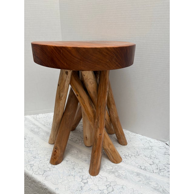 Elegant rustic natural wood carved stool with nine legs interwoven with each other. Elegant decor accent, end table or...