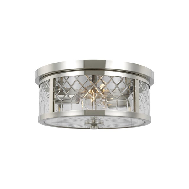 Finding inspiration from patterns, the AH by Alexa Hampton Alec two light flush mount in the burnished brass finish lend a...