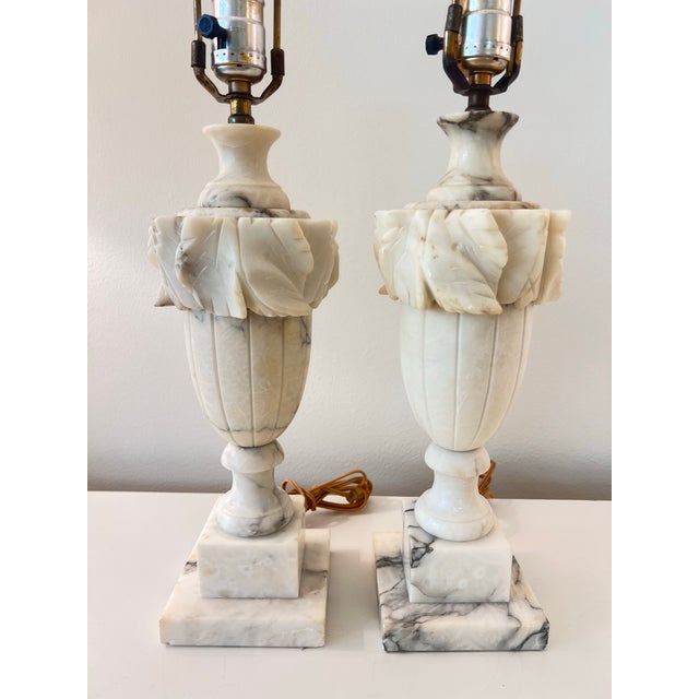 This is a beautiful pair of antique marble table lamps with a beautiful carved swag design on urn-shaped base. They have a...