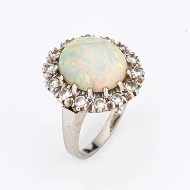 Finely detailed vintage opal & diamond cocktail ring (circa 1950s to 1960s), crafted in 14 karat white gold. Solid natural...
