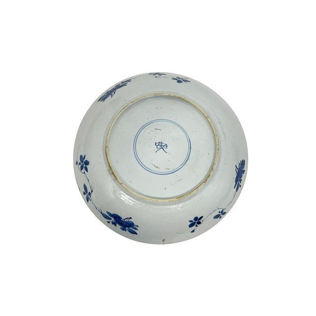 A Blue and White Dish, Qing Dynasty, Kangxi Period A Blue and White porcelain dish decorated with underglaze white and...