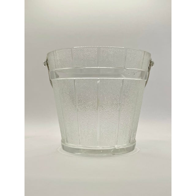 A charming mid 20th century pressed glass ice bucket formed to look like a joined plank pail with silver toned hammer...