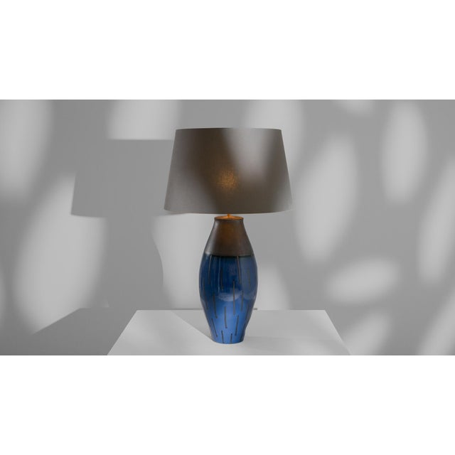 Illuminate your space with the captivating aura of the 20th Century German Ceramic Table Lamp, a masterpiece of both form...
