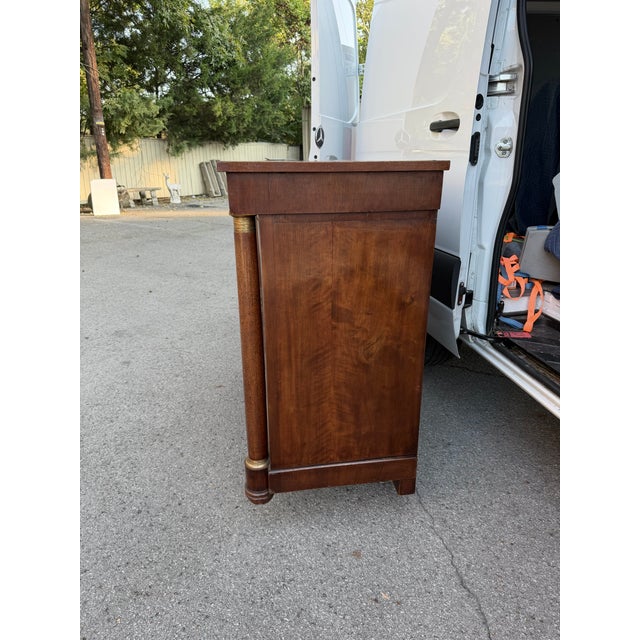 This is a beautiful 19th Century French empire Server . A long single drawer is located under the simple top. A pair of...