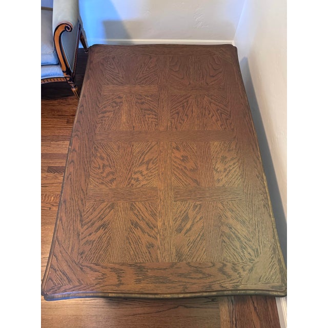 This Louis XV Style Oak Parquet CoffeeTable features a finely contoured and beveled top frame surrounding diamond parquet...