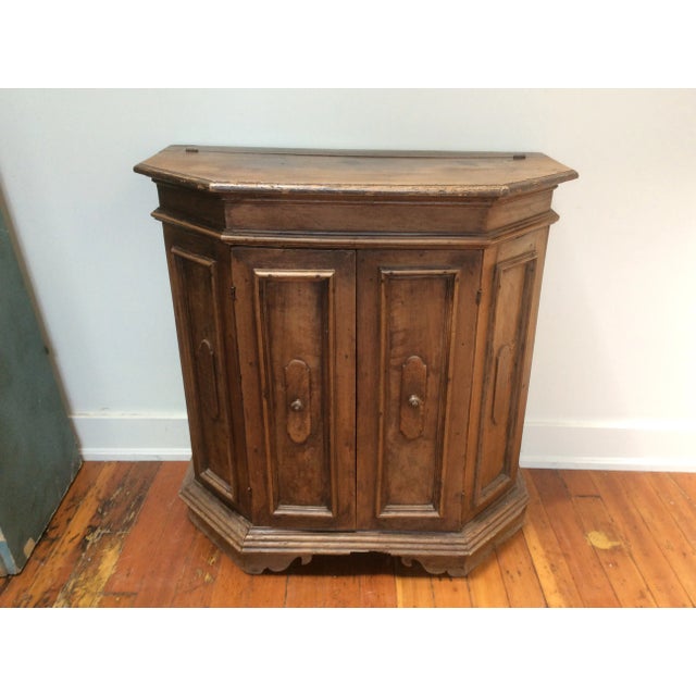 Great looking 18th Century Italian walnut Credenza or Cabinet.this has a lift top chamber area and two doors with an...