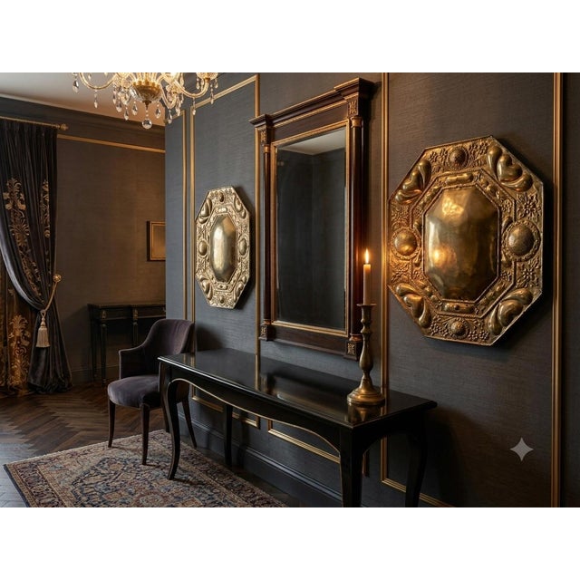 A matching pair of late 19th to early 20th-century Dutch Revival octagonal brass wall plaques (chargers). Intricate,...