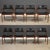 A set of eight mid century modern teak dining chairs designed by Erik Buch. Leather seats and backs. One seat has black...