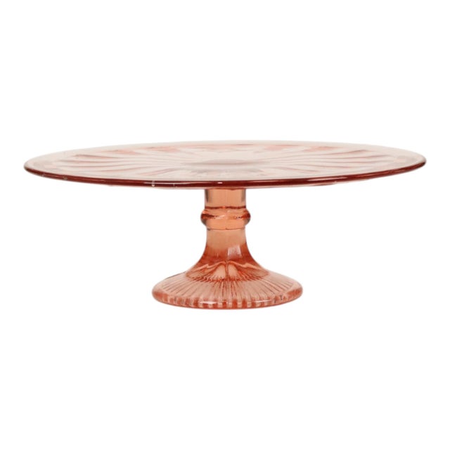 Large vintage cake stand from the Art Deco period; a serving dish made of pink pressed glass—also known as "Depression...