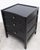 Pair of Noir Furniture three drawer nightstands. Black stained Mahogany with brass hardware. Items do not have any labels...
