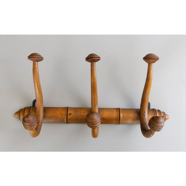 A superb antique French carved faux bamboo bentwood coat and hat rack, circa 1920. This fine coat rack has a stylish...