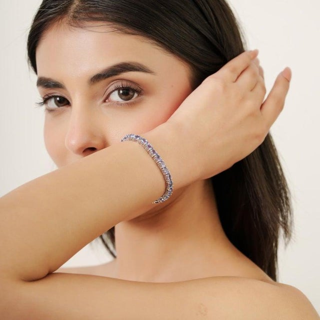 Oval Cut Tanzanite Eternity Style Tennis Bracelet in Sterling Silver For Sale - Image 6 of 11