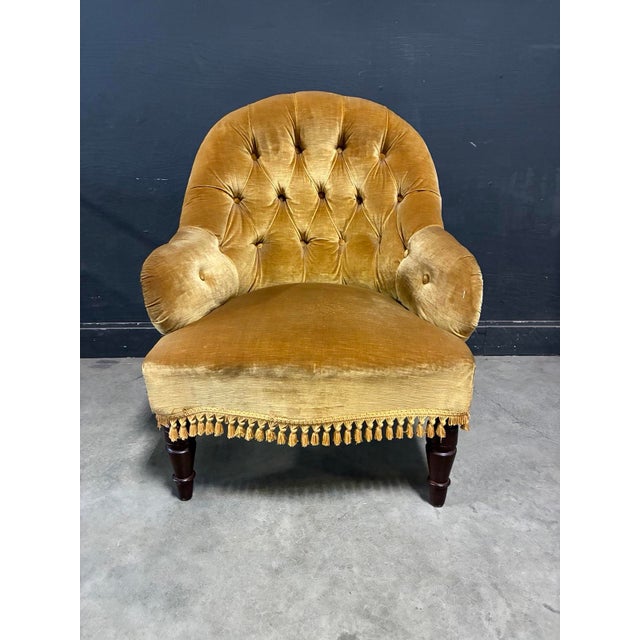 Antique French gold velvet rolled arm side chair with fringe at bottom makes a beautiful addition to any room, seat by a...