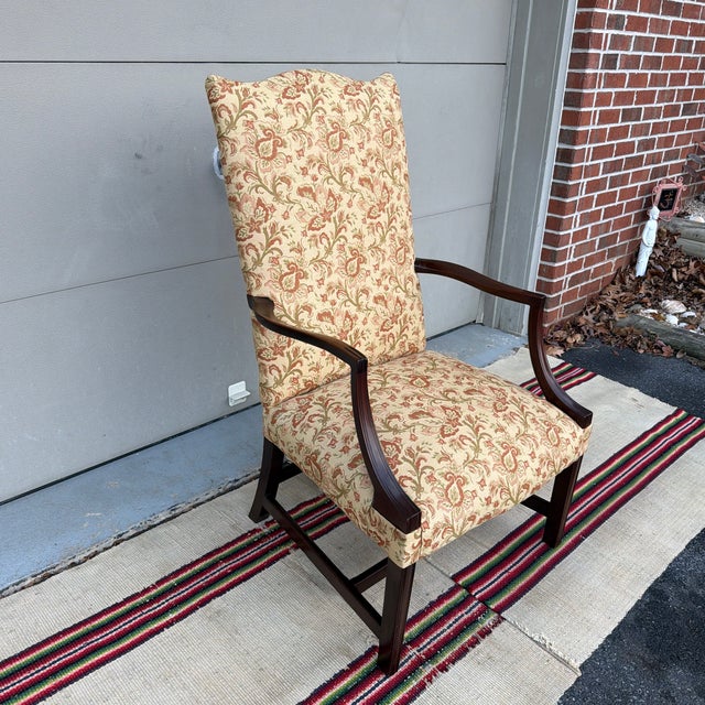 A Vintage Mahogany Hepplewhite Style Lolling Chair, Circa 1970’s Made in the USA, circa 1970's. Unknown manufacturer....