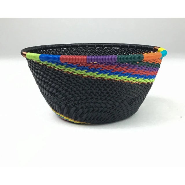 These little baskets make wonderful conversation pieces. Copper coated wires in bright colors are hand woven into baskets...