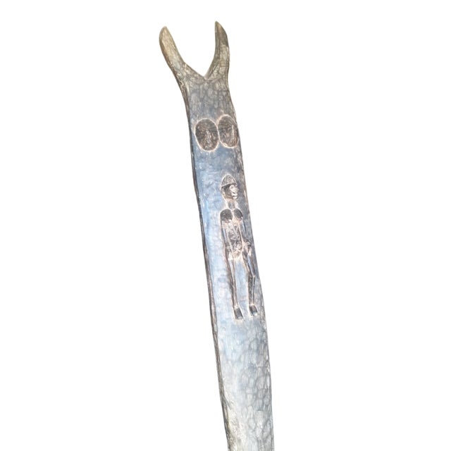 The main pillar of Case Toguna, a community center that bears witness to important decisions made by the village elders,...