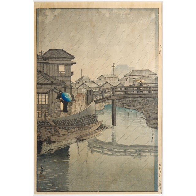 Kawase Hasui's "Rain at Shinagawa," a quietly atmospheric rain-on-water scene from one of the most collected names in...