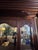 An impressive late 19th-century American Renaissance Revival sideboard featuring an elaborately carved mirrored hutch and...