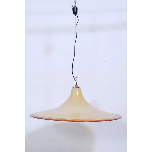 Beautiful production chandelier VM Murano glass of the 70s. Large lampshade in Murano glass in the shades of ocher yellow....