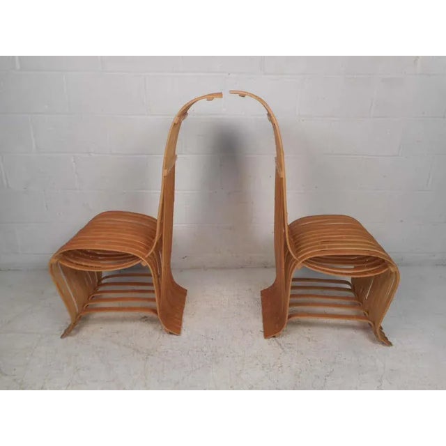 Interesting and unusual pair of wooden slat chairs. Quirky yet sturdy design. Great addition to any modern interior....
