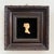 A perfect petite vintage piece to add to a gallery wall, this carved silhouette of a woman in resin is mounted on black...