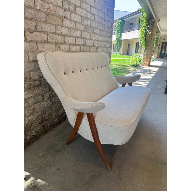Mid-Century Modern sculptural sofa by Theo Ruth produced by Artifort, newly reupholstered in a Cowtan and Tout oatmeal...