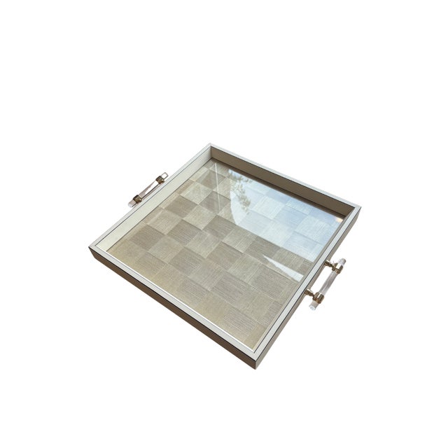 This neutral tray featuring a clean design, paired with crystal-clear acrylic and gold handles offers a chic, modern...