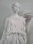 An elegant vintage mid-20th-century neoclassical reproduction figurine depicting Hebe, the Greek Goddess of Youth and...