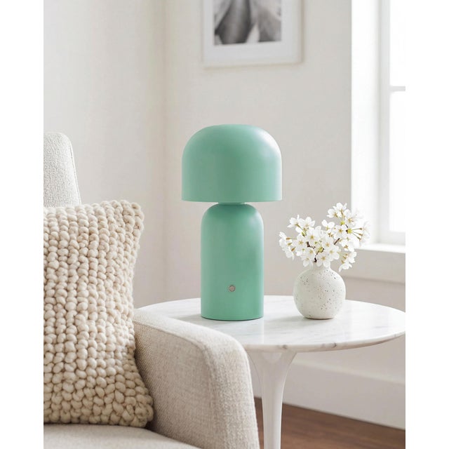 Illuminate your space with the Umbra accent table lamp, a beacon of minimalist modern style. Standing at a sleek 10 inches...