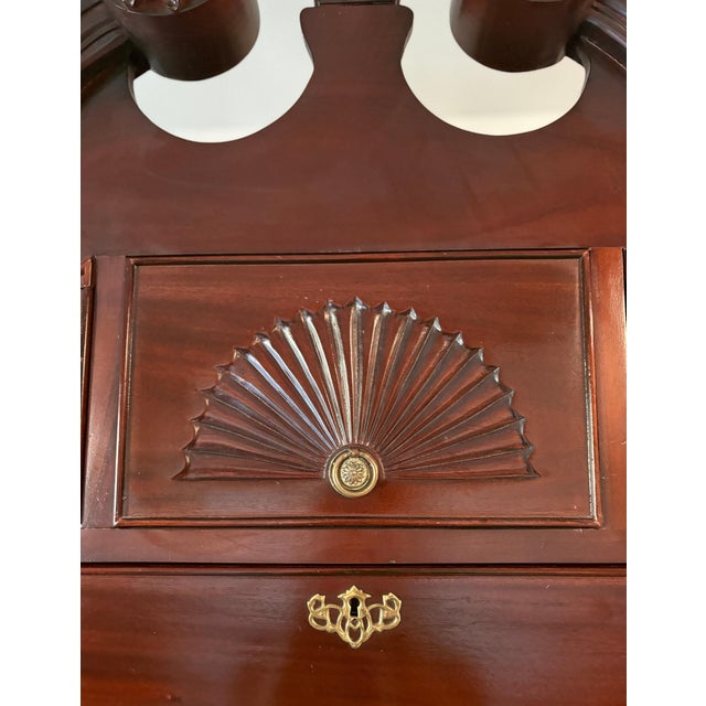 This vintage Chippendale-style highboy chest features classic Colonial-inspired design with quality traditional...