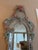 Elongated Murano Glass Mirror. Wooden backings, very heavy. It’s a beautiful piece of history with ornate flowers in pink...