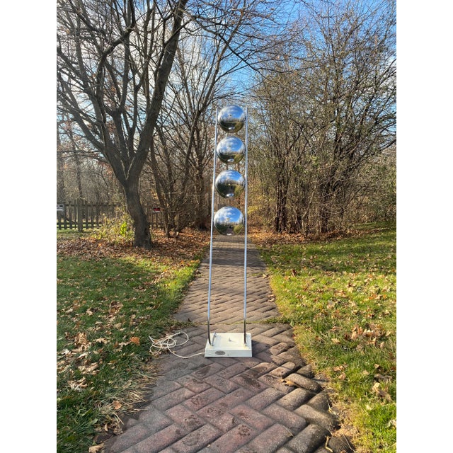 Rare 1970’s sculptural chrome space age atomic floor lamp. Four eyeball socket shades set upon arching arms. Chrome shades...