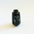 A petite glossy black vintage ceramic bud vase. Features the image of an iris with gold accents applied to the surface on...