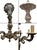 An ornate antique chandelier featuring elaborate ornamentation, sculptural curved arms, floral motifs, and a richly...