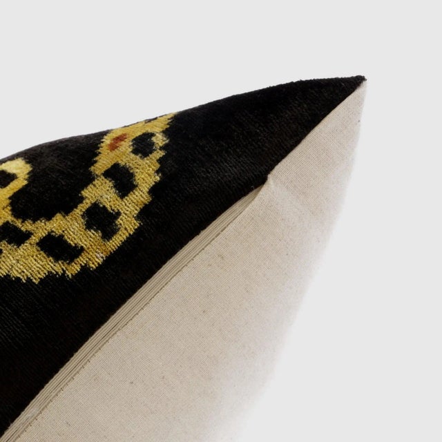 "Unleash your wild side with this handmade silk velvet throw pillow featuring a bold leopard design in rich shades of...