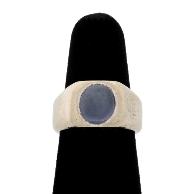 14K White Gold Star Sapphire Ring, featuring one flush set purple star sapphire cabochon weighing approx. 3.65 carats....