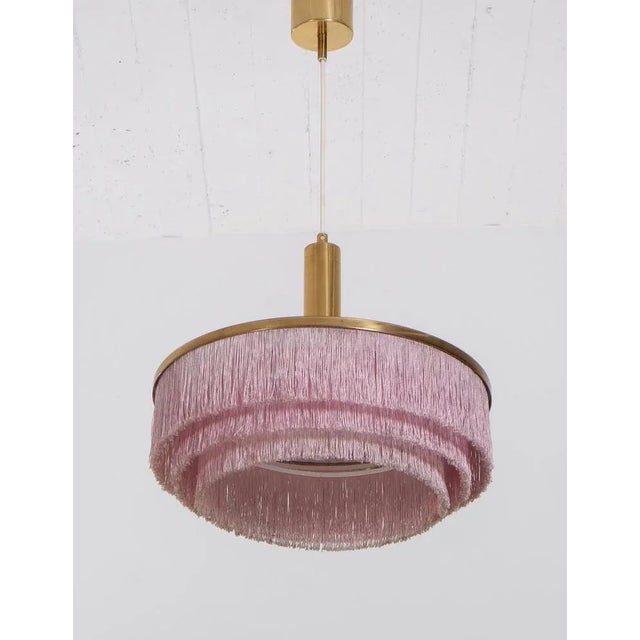 Hans-Agne Jakobsson pendant with pink/purple fringes, 1960s. Produced in Sweden by Hans-Agne Jakobsson AB in Markaryd,...