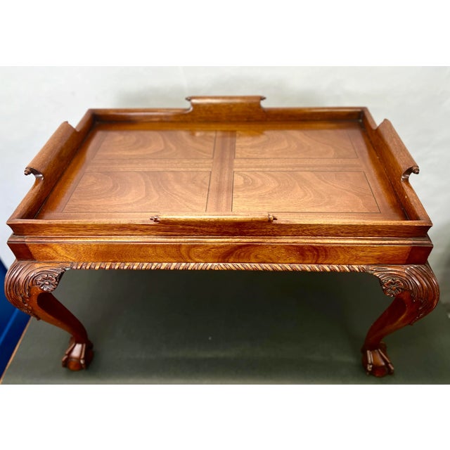 I wonderful wooden tray table from England circa 1940The claw foot cabriole legs make this English built table stand out....
