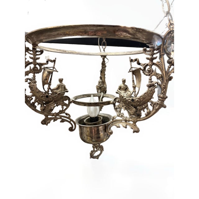 This Edwardian oil chandelier was crafted and stamped in 1891. At some point in its history it was converted to an...