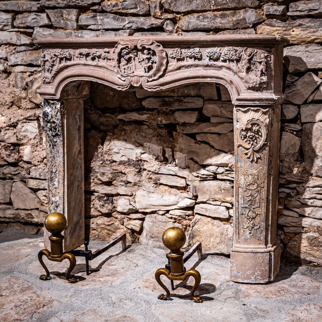 Baroque fireplace surround in Main sandstone featuring a central shell cartouche with figural scenes, tree motifs, and...