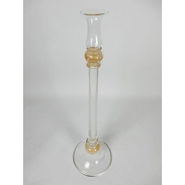Fabulous tall candle stick signed "Seguso Vetri d'Arte" on base. Gold fleck in clear glass. Flawless condition. Measure:...