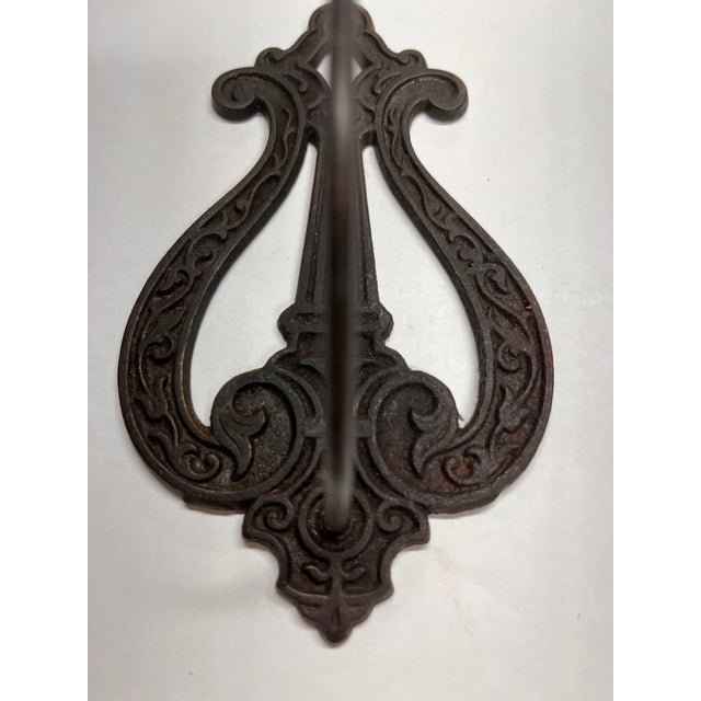 Antique Victorian cast iron wall receipt holder.