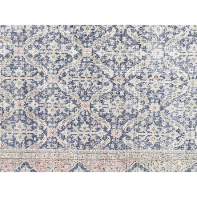 This Vintage Turkish Oushak Rug adds a vibrant touch to any home with its combination of wool and cotton. Measuring 9'3" x...