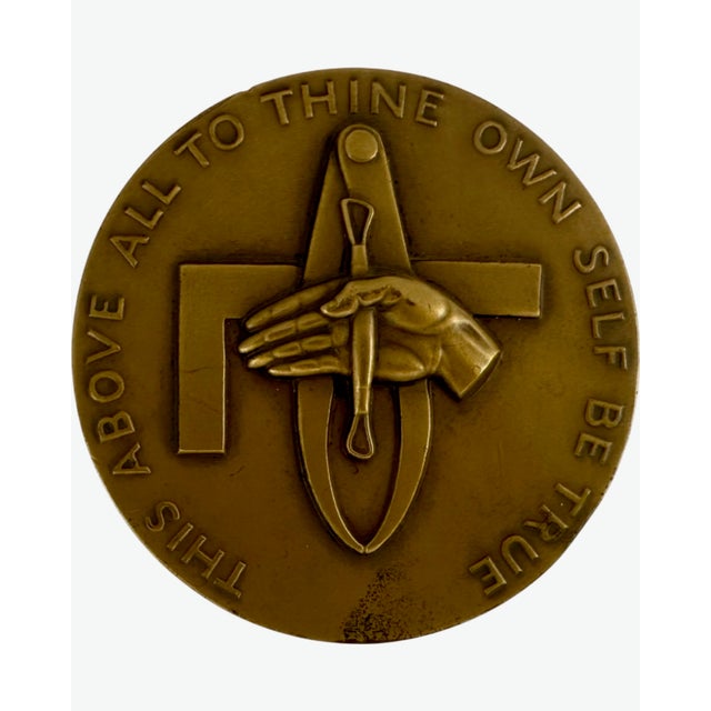 Executed in a rich, warm patina, the obverse features the inscription “This Above All: To Thine Own Self Be True”—a line...