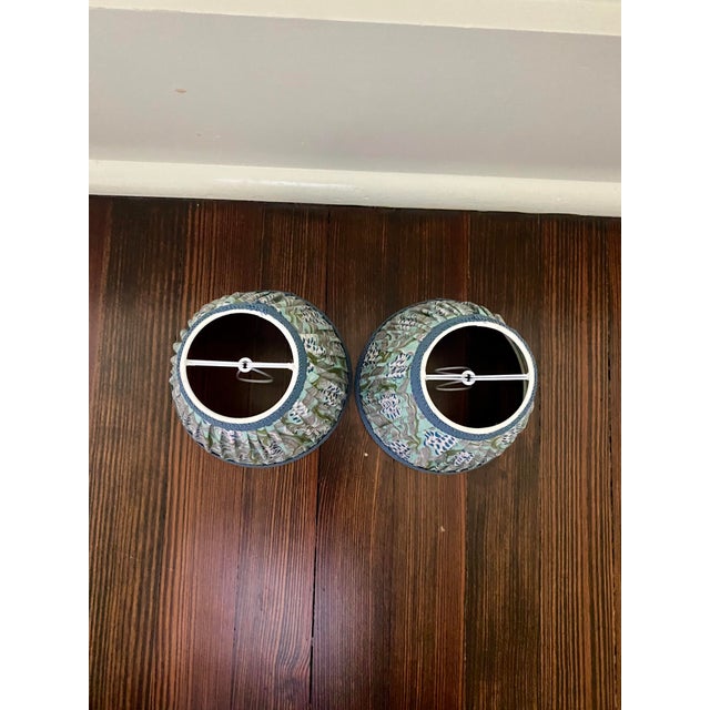 Beautiful pair of custom shirred sconce shades in a block print textile featuring shades of aqua, lapis blue, taupe and...