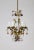 A gilt brass chandelier with dangling crystal fruit in amber, purple, amethyst, and clear. Apples hang from the crown and...
