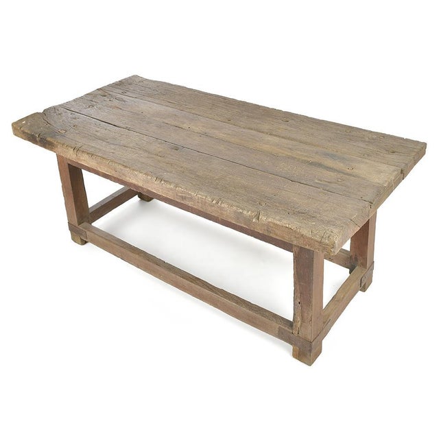 This large antique table seduces with its rustic look and its construction entirely in solid wood. The top, formed of wide...