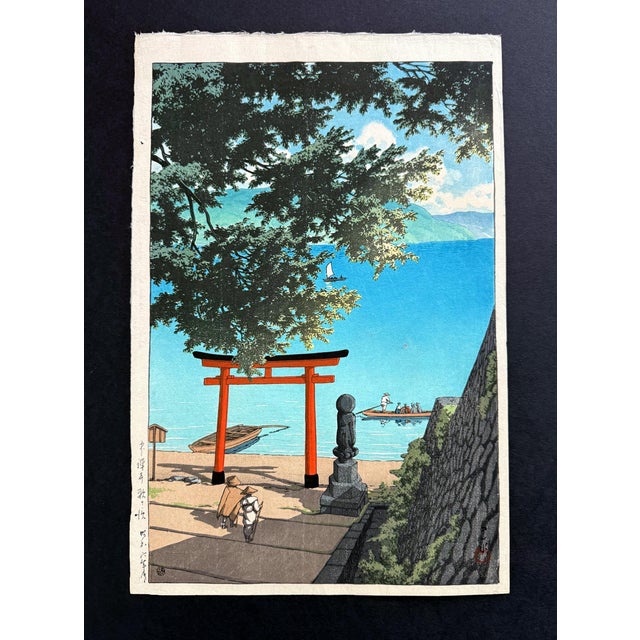 This woodblock print by Kawase Hasui (1883–1957), entitied Chuzenji Temple at Utagahama Beach, was created in Showa 6th...
