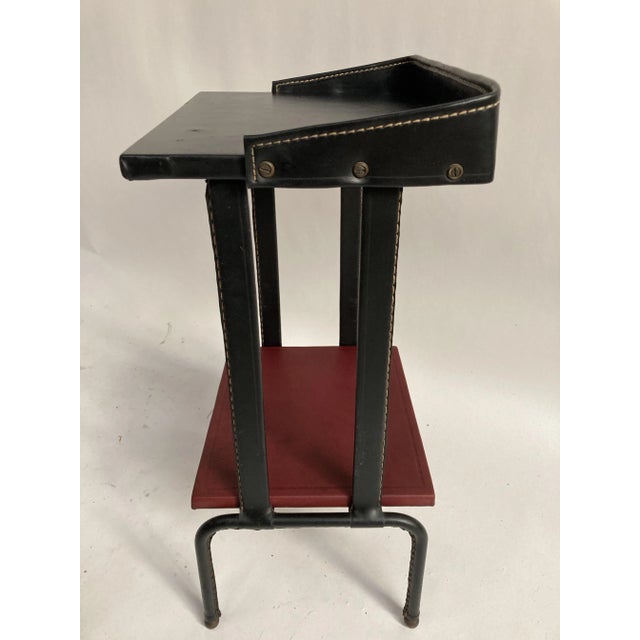 Leather-covered table in very good condition I have official proof of authenticity such as vintage catalogs, designer...