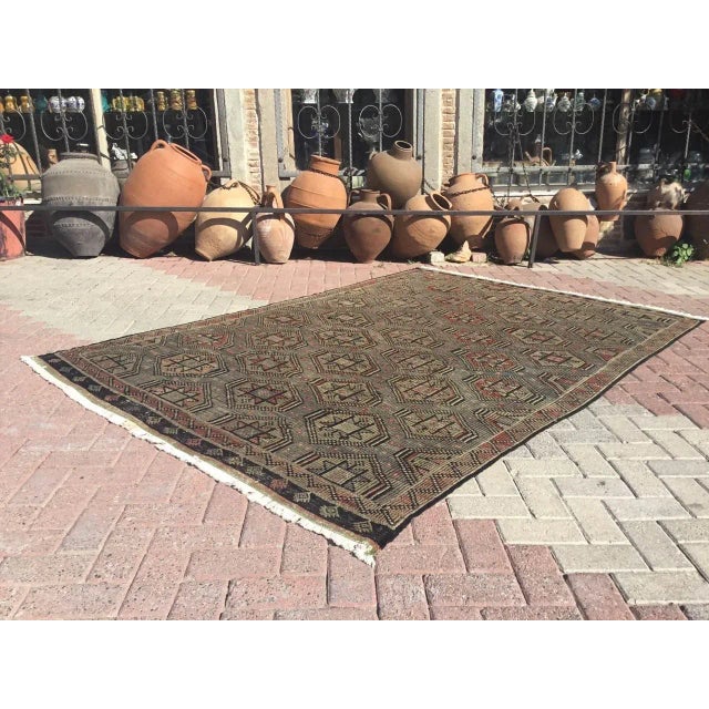 This beautiful, vintage, handwoven kilim is approximately 60 years old. It is handmade, of very fine quality hand spun...